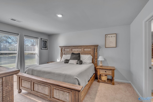 bedroom featuring light colored carpet