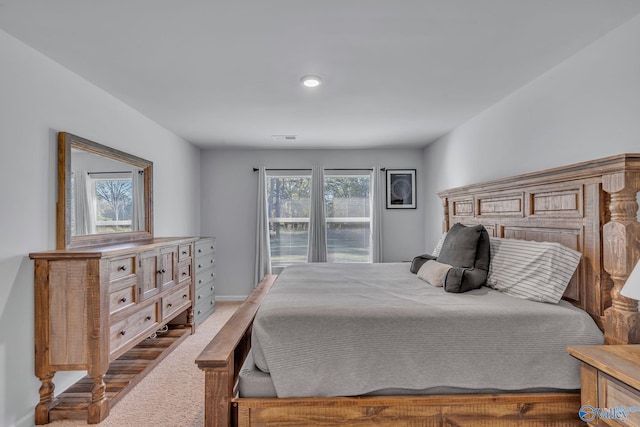 bedroom featuring multiple windows and carpet floors