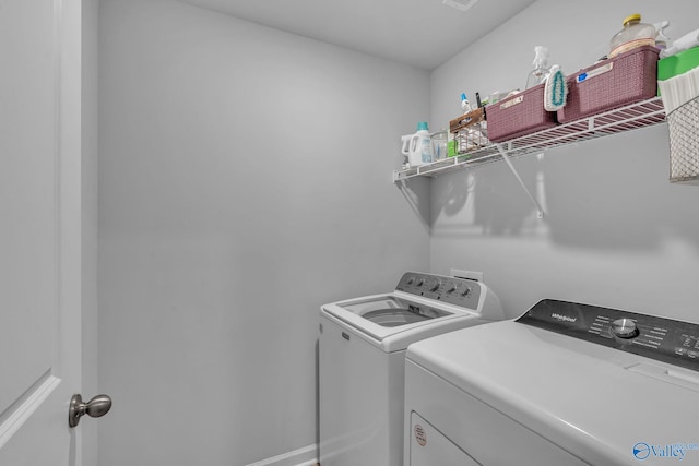 laundry room with washing machine and dryer