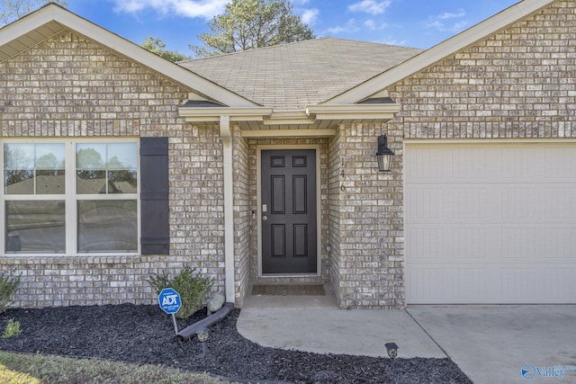 view of exterior entry featuring a garage