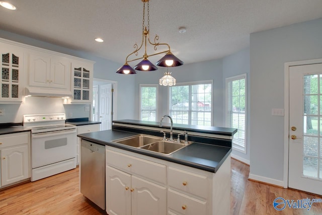 kitchen with dark countertops, dishwasher, white electric range, and under cabinet range hood