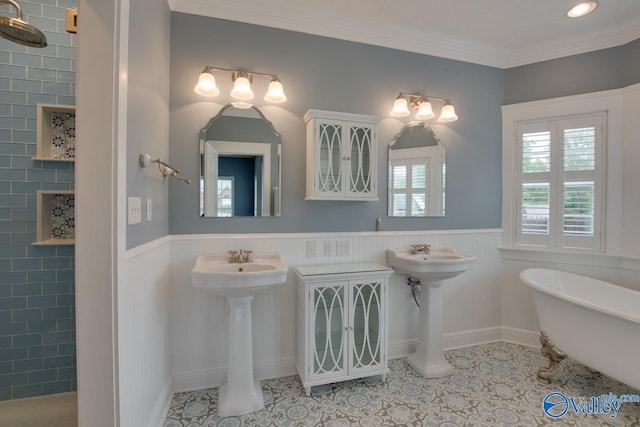 bathroom with a tile shower, a soaking tub, a wainscoted wall, and ornamental molding