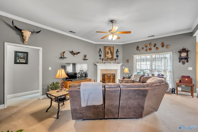 carpeted living room featuring crown molding and ceiling fan