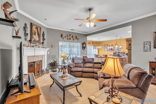 carpeted living room featuring crown molding, a fireplace, and ceiling fan