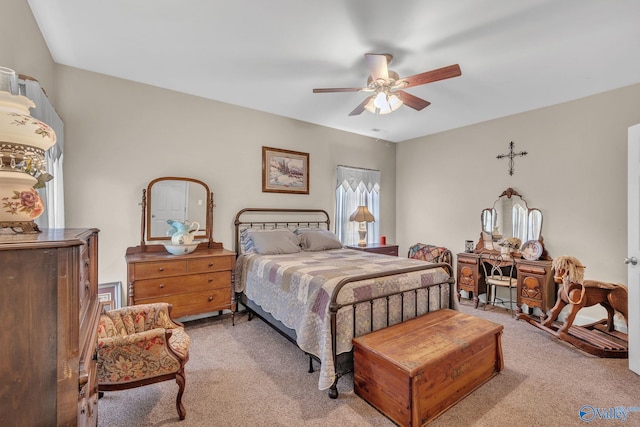 bedroom featuring light carpet and ceiling fan