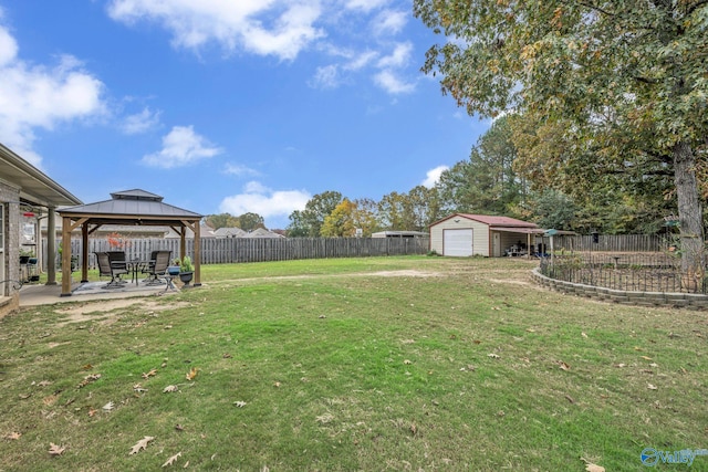 view of yard featuring a gazebo, a storage shed, and a patio area