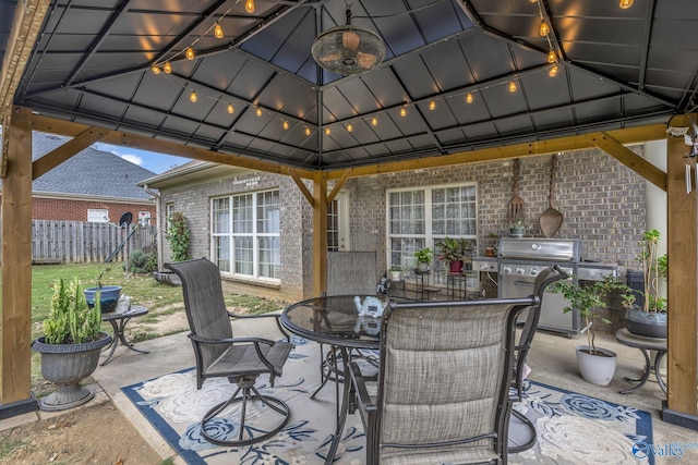 view of patio / terrace featuring a gazebo and a grill