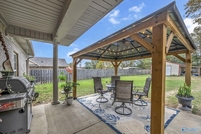 view of patio / terrace with a gazebo and a shed