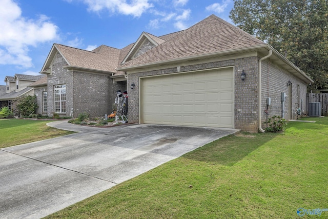 view of front facade featuring central AC, a garage, and a front lawn