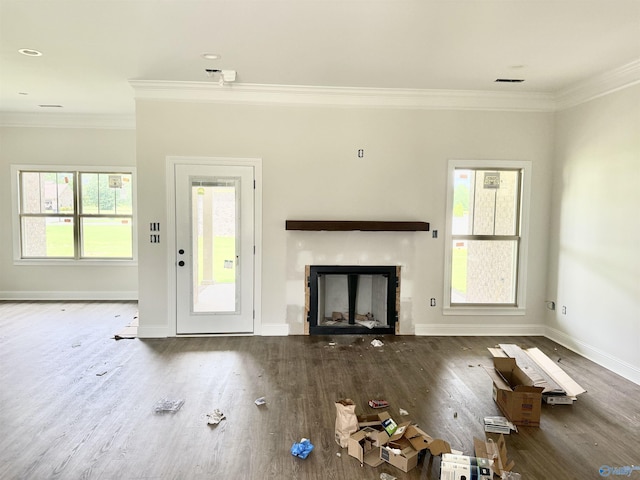 1005 Newbury Cv SW, Decatur, AL 35603 - unfurnished living room featuring crown molding, a fireplace, wood finished floors, and baseboards