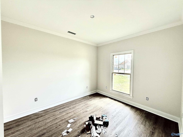1005 Newbury Cv SW, Decatur, AL 35603 - unfurnished room featuring dark wood finished floors, baseboards, and ornamental molding