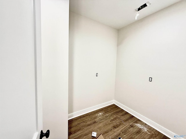 1005 Newbury Cv SW, Decatur, AL 35603 - washroom featuring dark wood-type flooring and baseboards