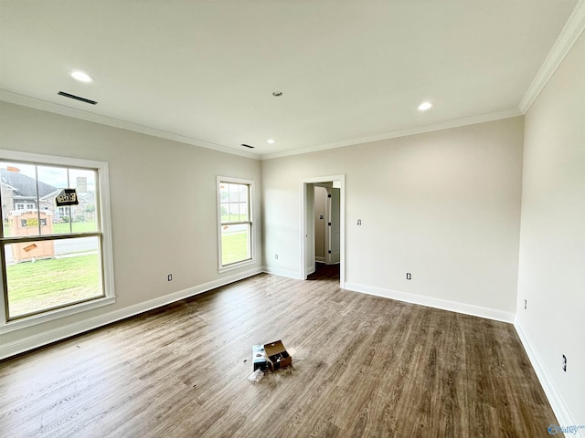 1005 Newbury Cv SW, Decatur, AL 35603 - unfurnished room with wood finished floors, baseboards, recessed lighting, and crown molding