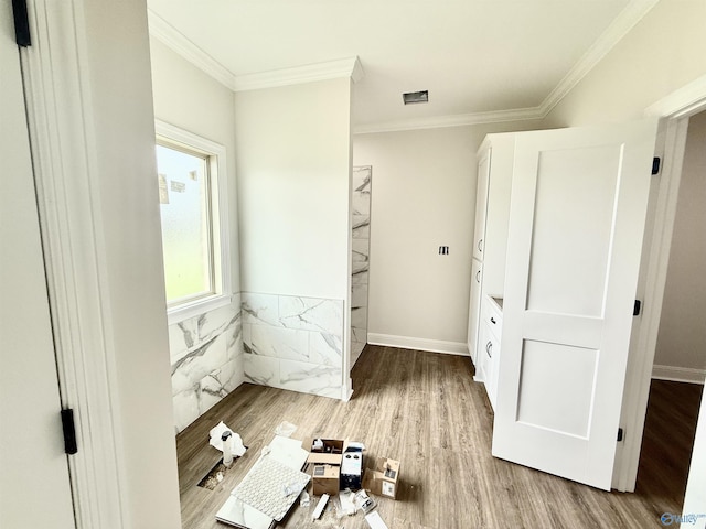1005 Newbury Cv SW, Decatur, AL 35603 - unfurnished bedroom with crown molding, wood finished floors, baseboards, and wainscoting