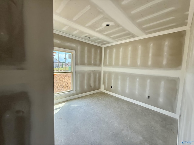 unfurnished room with concrete flooring