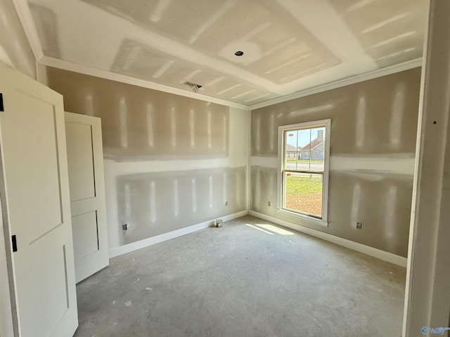 empty room featuring baseboards and unfinished concrete floors