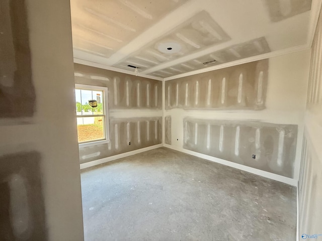 spare room with unfinished concrete floors and baseboards
