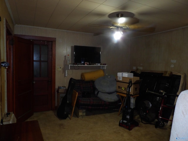 carpeted bedroom featuring ornamental molding and ceiling fan