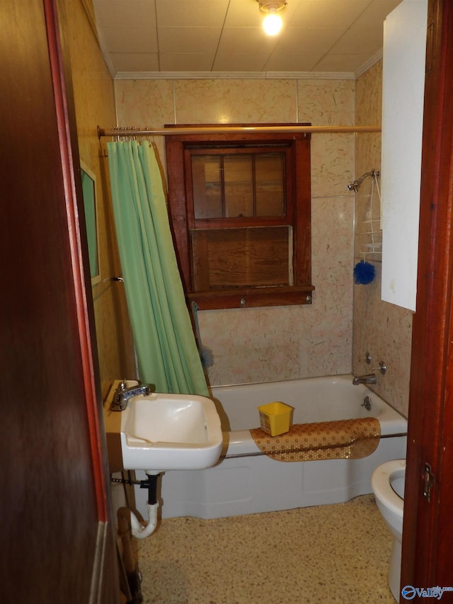 full bathroom with sink, shower / tub combo, and toilet