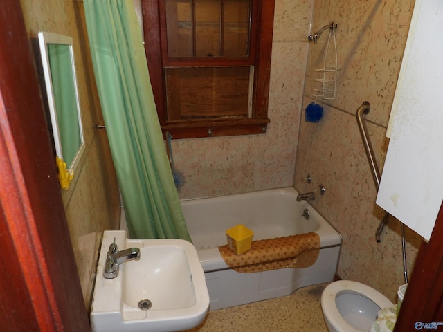 full bathroom with sink, toilet, and shower / tub combo with curtain