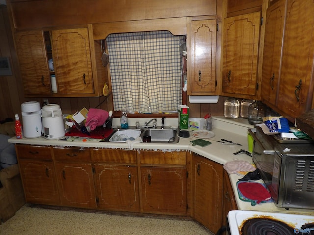 kitchen with wooden walls and sink