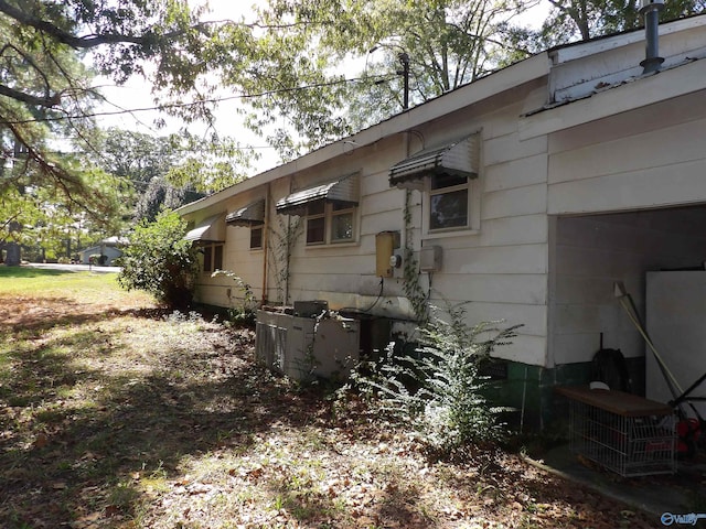 view of home's exterior with cooling unit