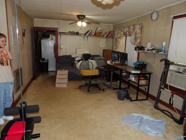 office space featuring crown molding, light carpet, ceiling fan, and cooling unit