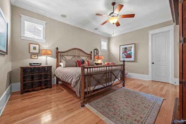 9 Beck St NW, Huntsville, AL 35806 - bedroom with ceiling fan, baseboards, crown molding, and light wood-type flooring