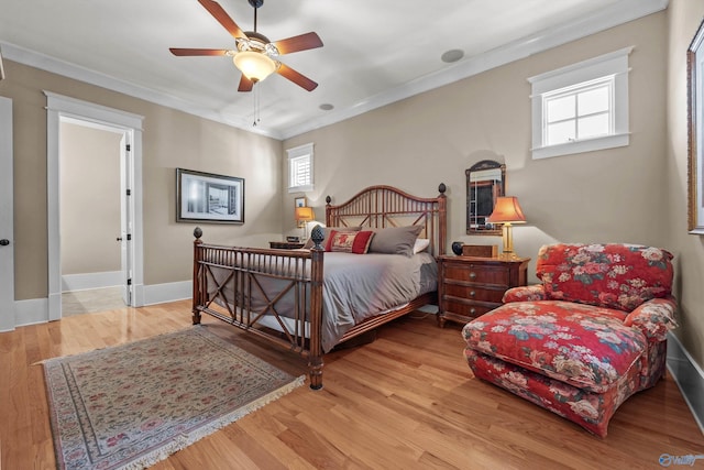 9 Beck St NW, Huntsville, AL 35806 - bedroom featuring a ceiling fan, baseboards, ornamental molding, and wood finished floors