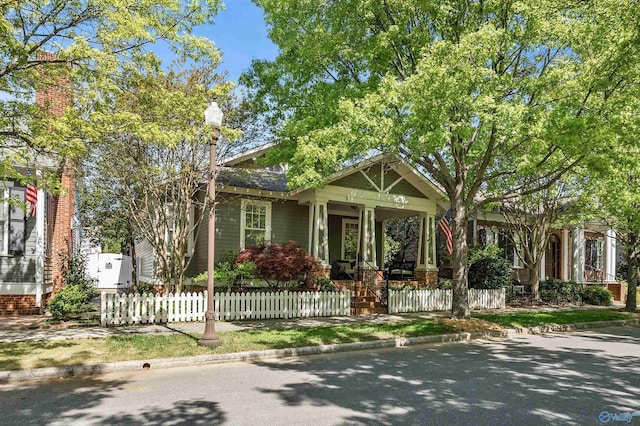 9 Beck St NW, Huntsville, AL 35806 - view of front facade featuring a fenced front yard and covered porch