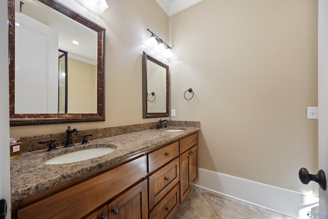 9 Beck St NW, Huntsville, AL 35806 - bathroom with ornamental molding, tile patterned floors, a sink, and double vanity