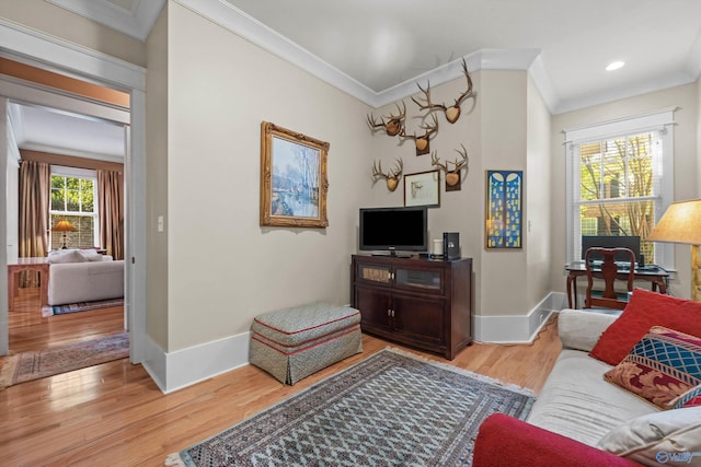 9 Beck St NW, Huntsville, AL 35806 - living area with baseboards, ornamental molding, wood finished floors, and recessed lighting
