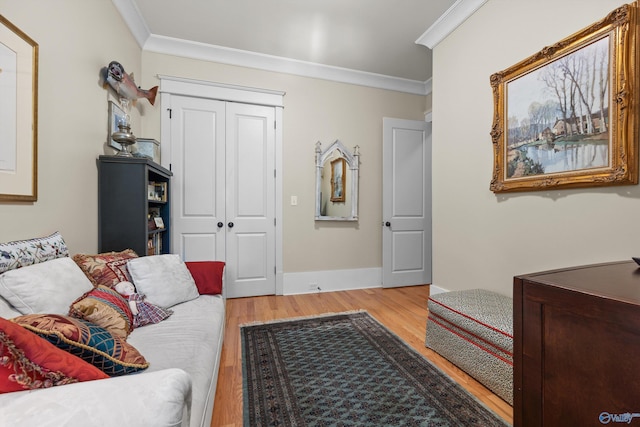 9 Beck St NW, Huntsville, AL 35806 - living room featuring light wood finished floors, baseboards, and ornamental molding