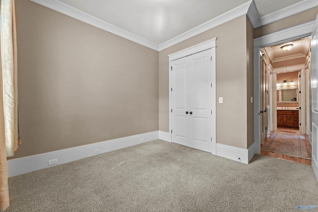 9 Beck St NW, Huntsville, AL 35806 - unfurnished bedroom with attic access, carpet, a closet, and ornamental molding