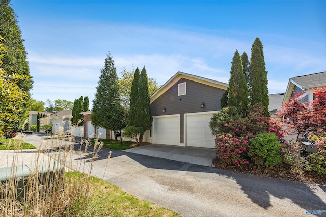 9 Beck St NW, Huntsville, AL 35806 - view of front of property with a detached garage
