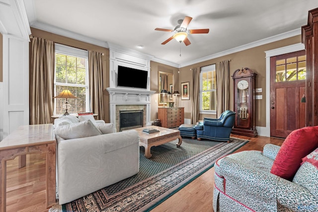 9 Beck St NW, Huntsville, AL 35806 - living area with ornamental molding, a ceiling fan, wood finished floors, and a fireplace