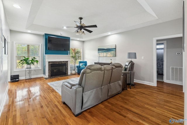 2801 Mountain View Dr, Southside, AL 35907 - living room featuring a tray ceiling, a ceiling fan, wood finished floors, plenty of natural light, and recessed lighting
