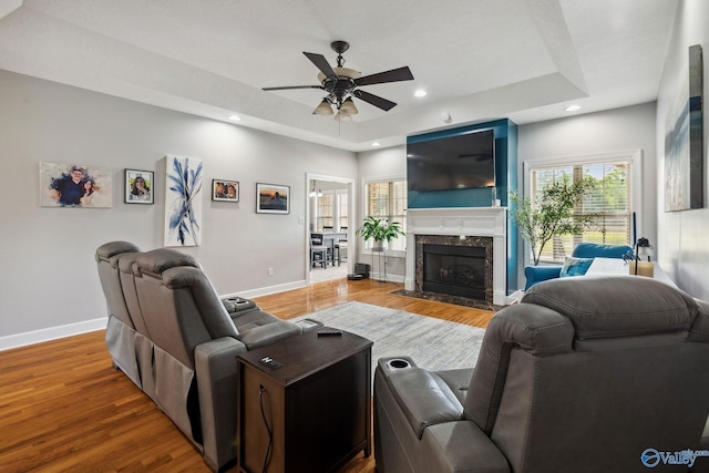 2801 Mountain View Dr, Southside, AL 35907 - living area with a tray ceiling, a ceiling fan, wood finished floors, a premium fireplace, and recessed lighting