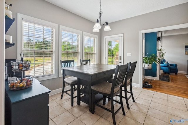 2801 Mountain View Dr, Southside, AL 35907 - dining room with light tile patterned floors and a chandelier