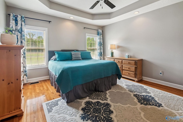 2801 Mountain View Dr, Southside, AL 35907 - bedroom featuring light wood-style flooring, recessed lighting, a ceiling fan, and a tray ceiling