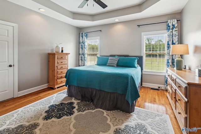 2801 Mountain View Dr, Southside, AL 35907 - bedroom featuring light wood finished floors, recessed lighting, a ceiling fan, and a tray ceiling