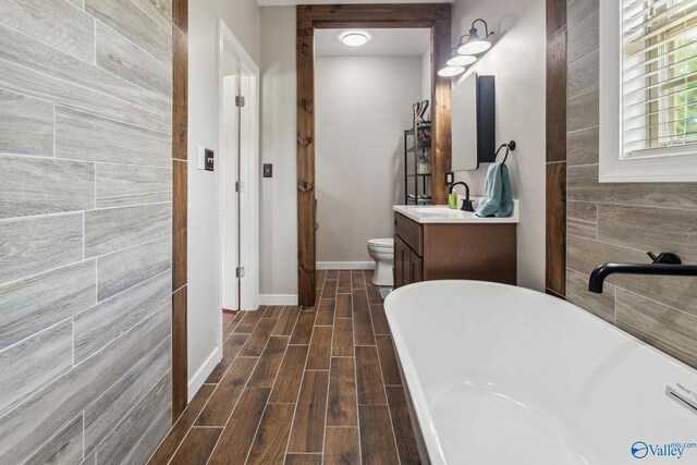 2801 Mountain View Dr, Southside, AL 35907 - bathroom with a freestanding bath, vanity, and wood finish floors