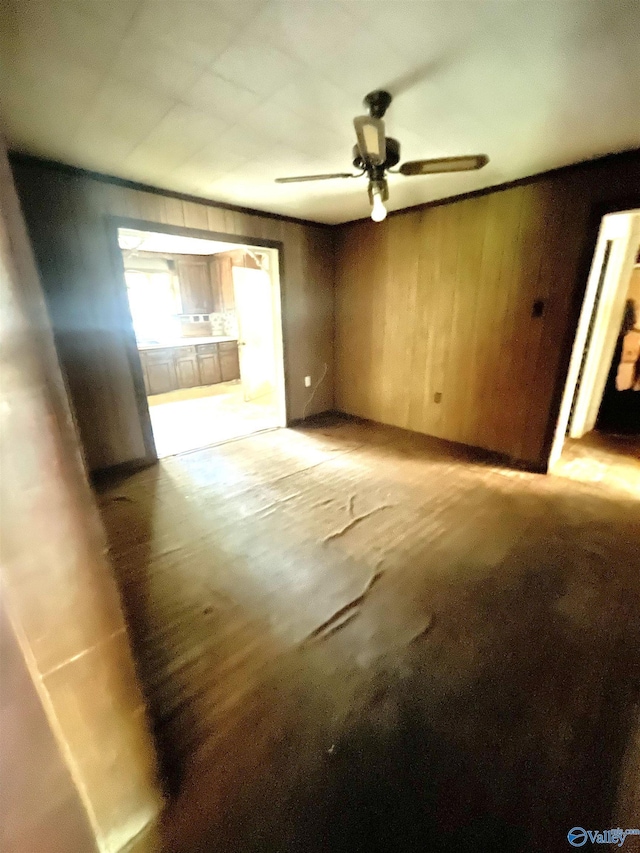 unfurnished living room featuring ceiling fan