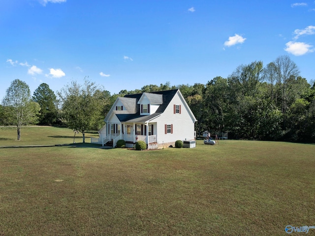 view of home's exterior with a lawn and a porch