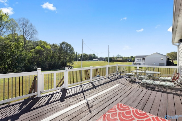 deck featuring a lawn