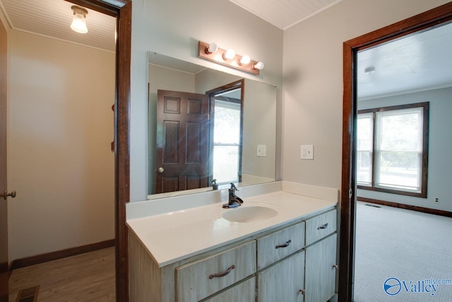 bathroom with vanity and crown molding