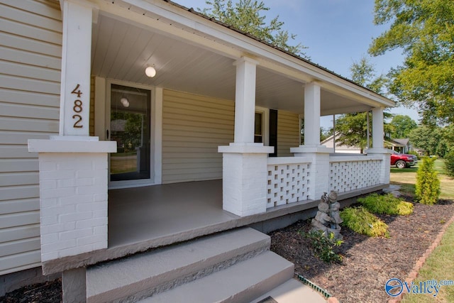 property entrance featuring covered porch