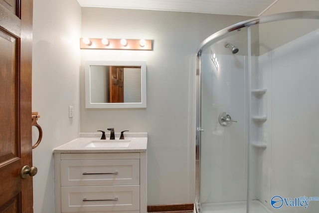 bathroom with vanity and a shower with shower door