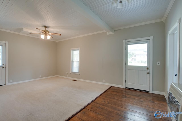 entryway with dark wood-type flooring, ceiling fan, a healthy amount of sunlight, and crown molding