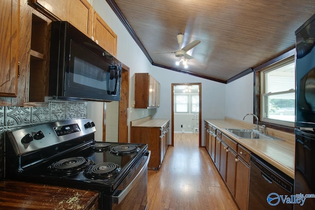 482 Mount Zion Rd, Madison, AL 35757 - kitchen featuring black appliances, vaulted ceiling, ceiling fan, crown molding, and light wood-style flooring